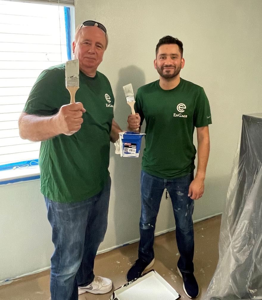 Matt Tekulve (L) and Abdul Aziz Jiwani (R) make progress painting the office space.